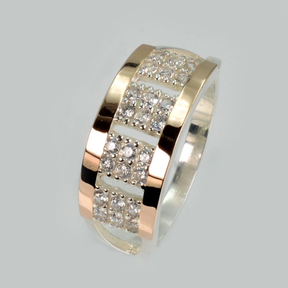 Срібна каблучка з золотими вставками