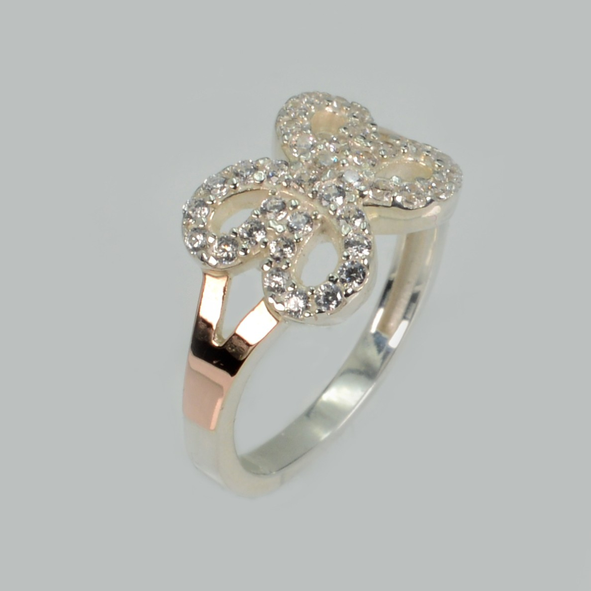 Срібна каблучка з золотими вставками