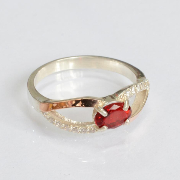 Срібна каблучка з золотими вставками