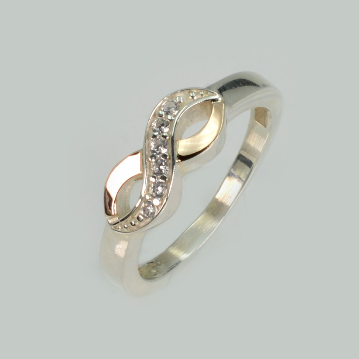 Срібна каблучка з золотими вставками