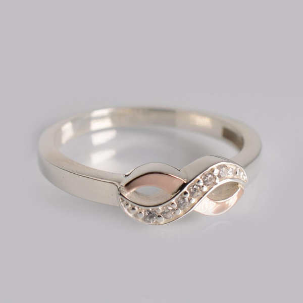 Срібна каблучка з золотими вставками