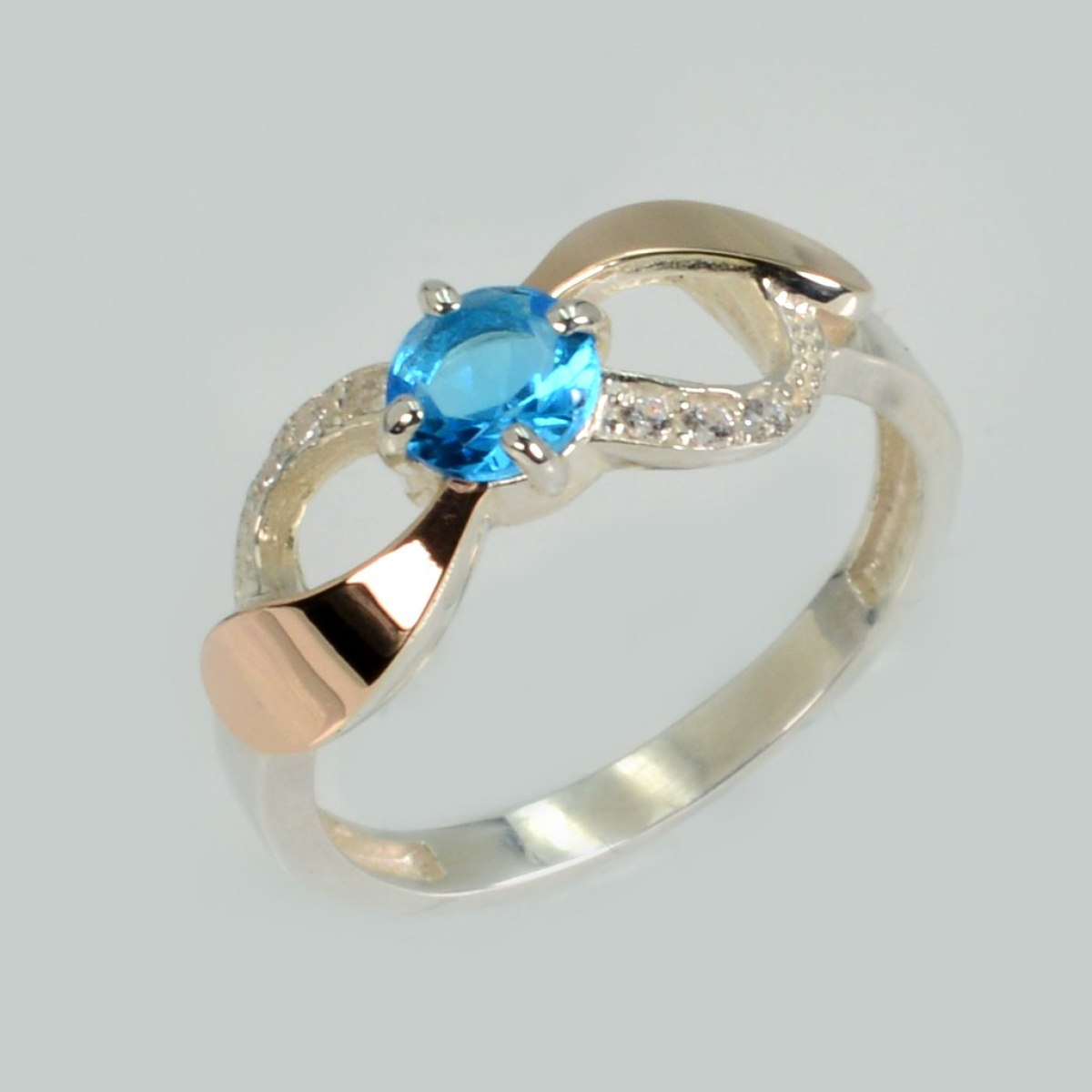 Срібна каблучка з золотими вставками