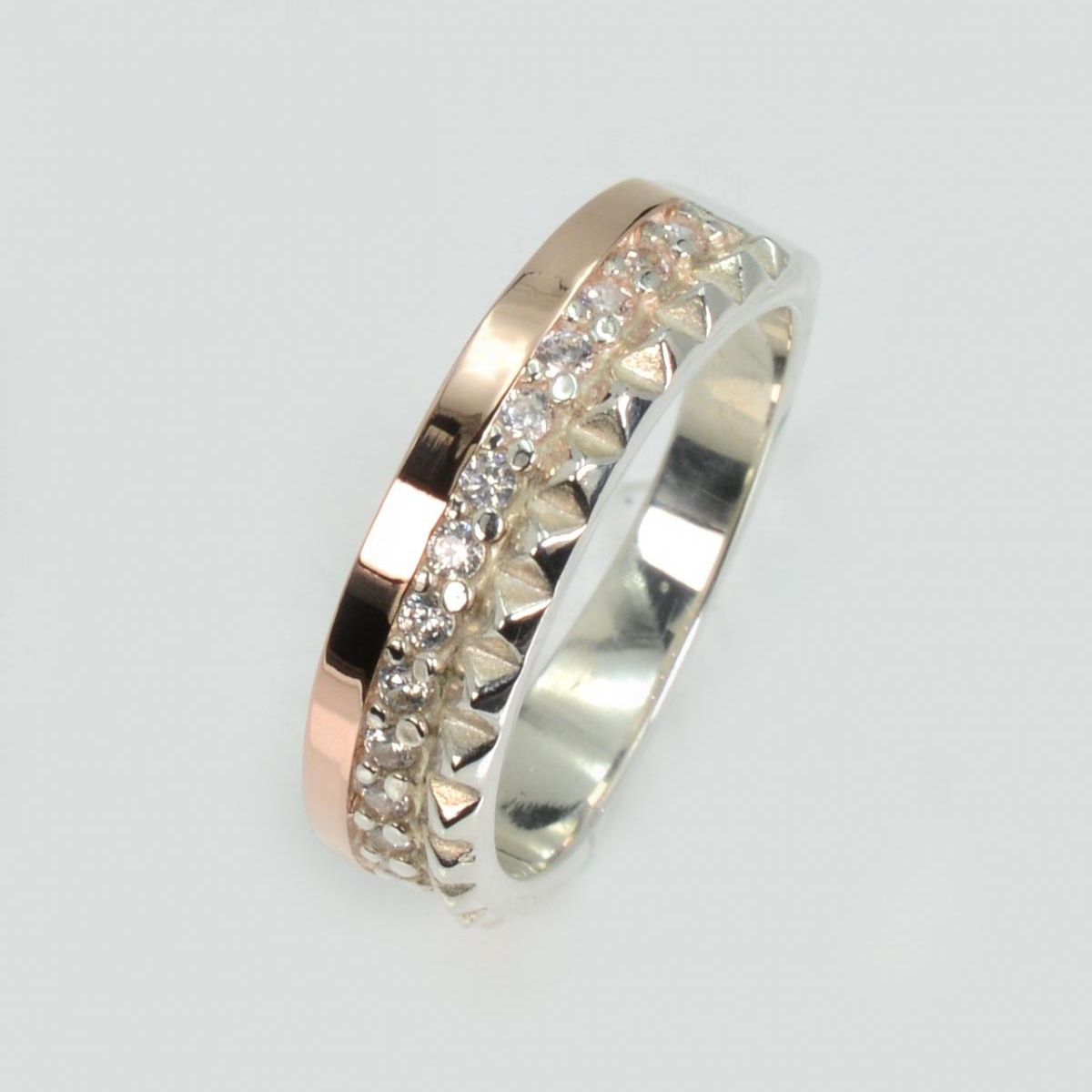 Срібна каблучка з золотими вставками