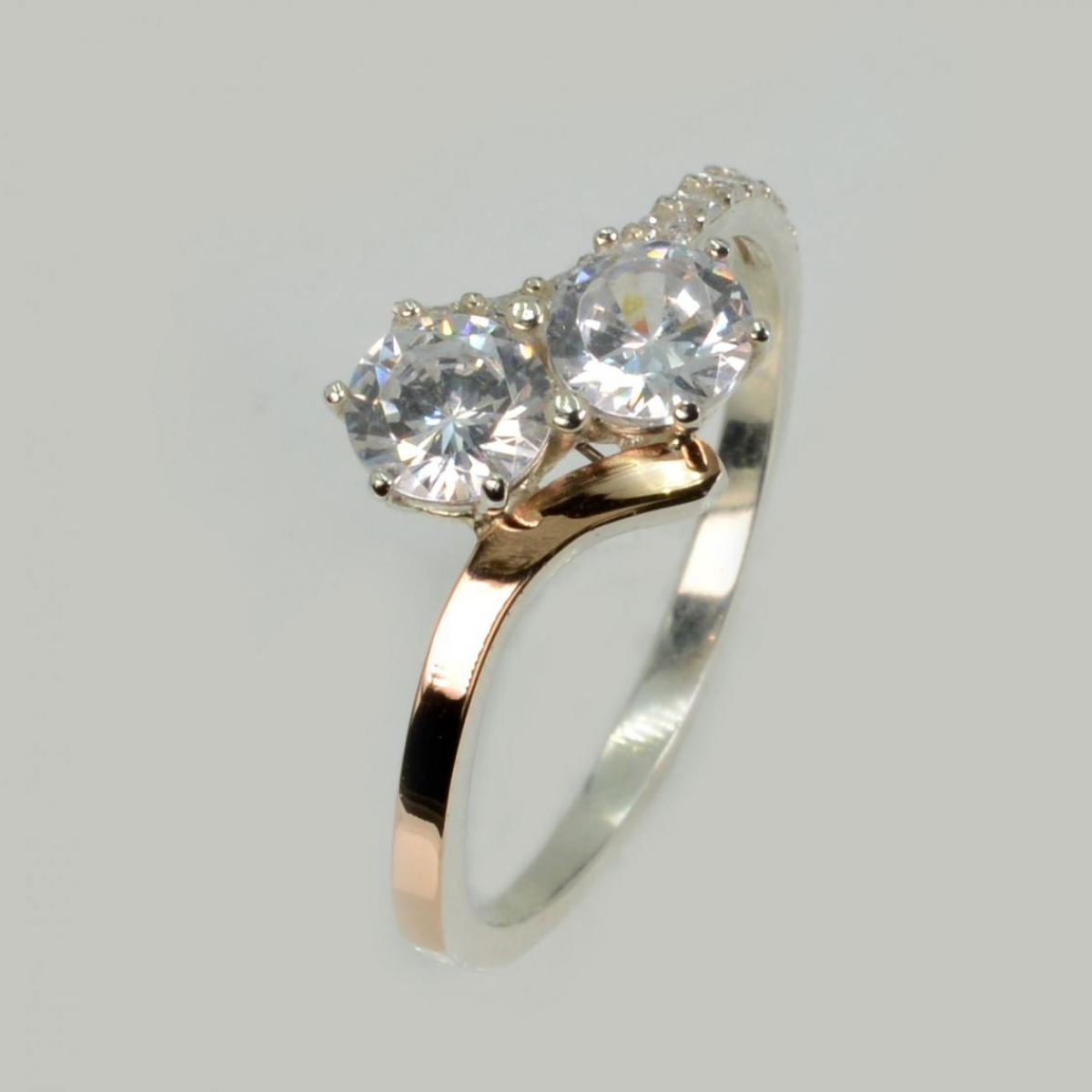 Срібна каблучка з золотими вставками