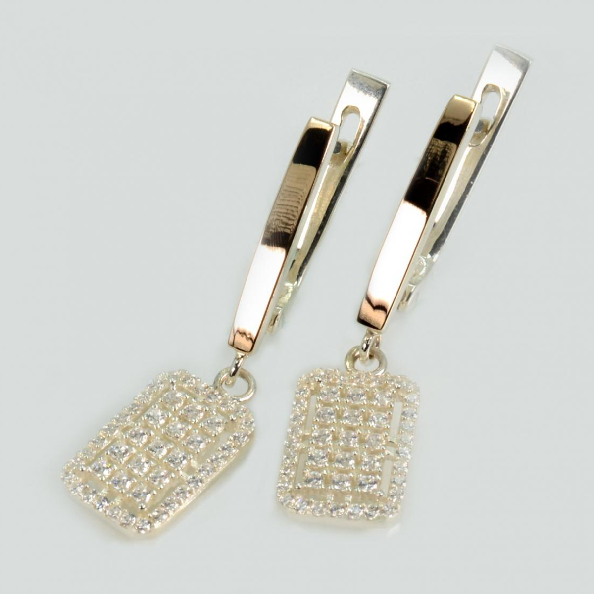 Срібні сережки з золотими пластинами