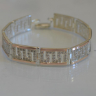 Срібний браслет з золотими пластинами