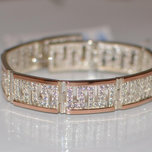 Срібний браслет з золотими пластинами