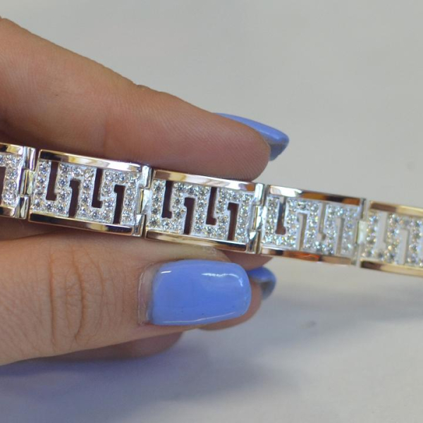 Срібний браслет з золотими пластинами