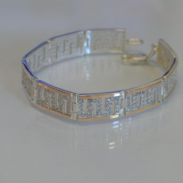 Срібний браслет з золотими пластинами