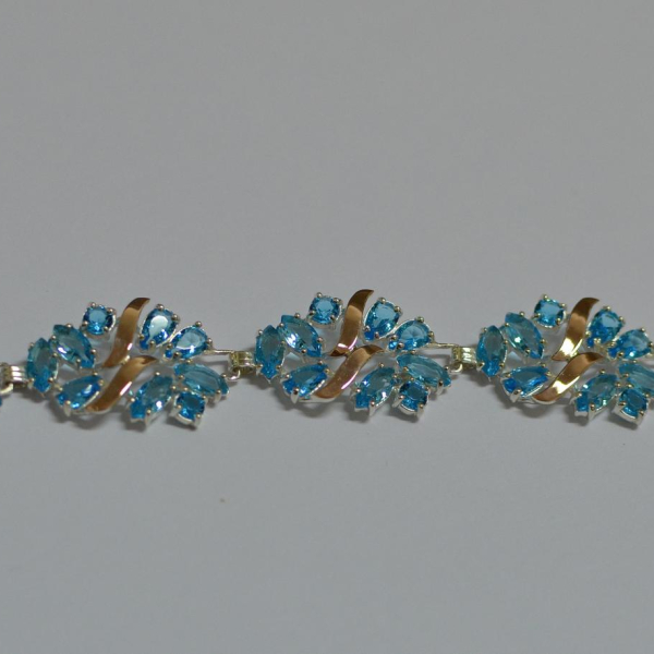 Срібний браслет з золотими вставками