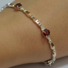 Срібний браслет з золотими пластинами