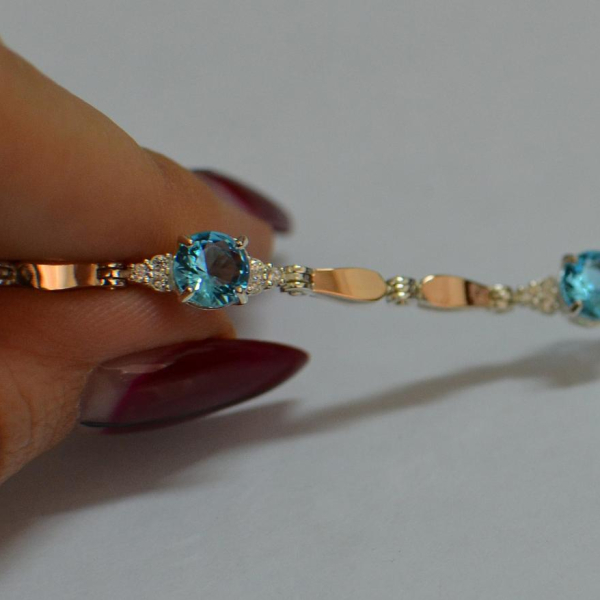 Срібний браслет з золотими пластинами