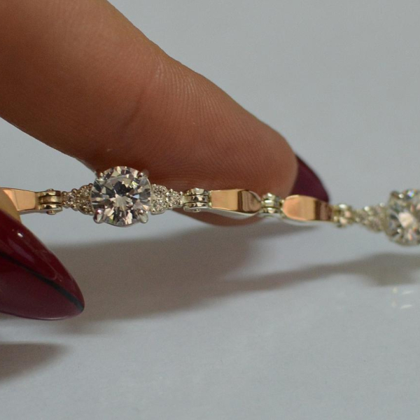 Срібний браслет з золотими пластинами