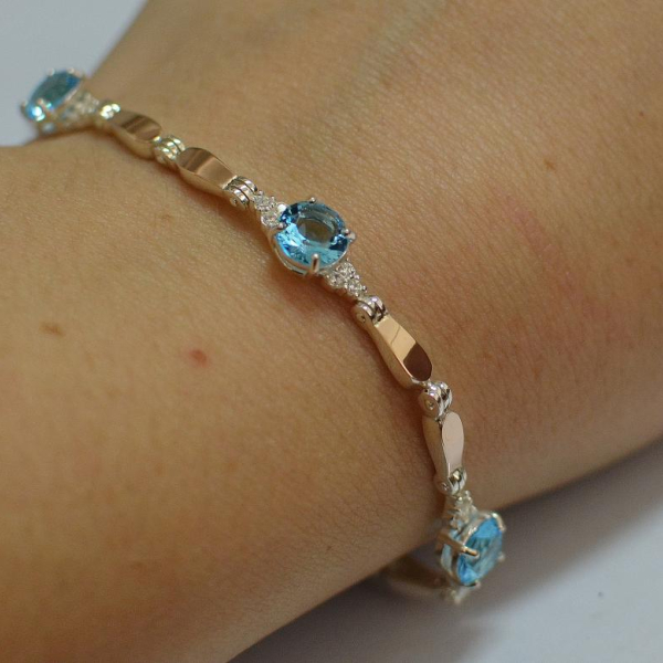 Срібний браслет з золотими пластинами