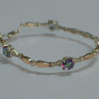 Срібний браслет з золотими пластинами