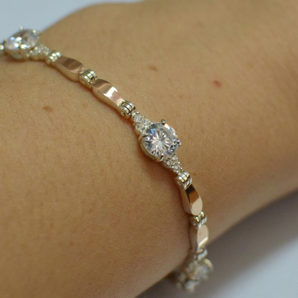 Срібний браслет з золотими пластинами