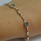 Срібний браслет з золотими пластинами