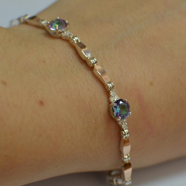 Срібний браслет з золотими пластинами