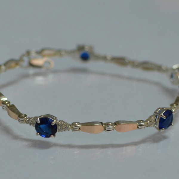 Срібний браслет з золотими пластинами