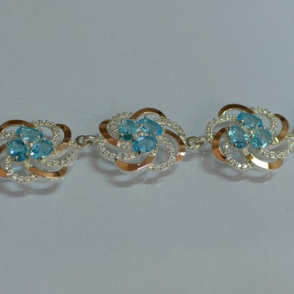 Серебряный браслет с золотыми вставками