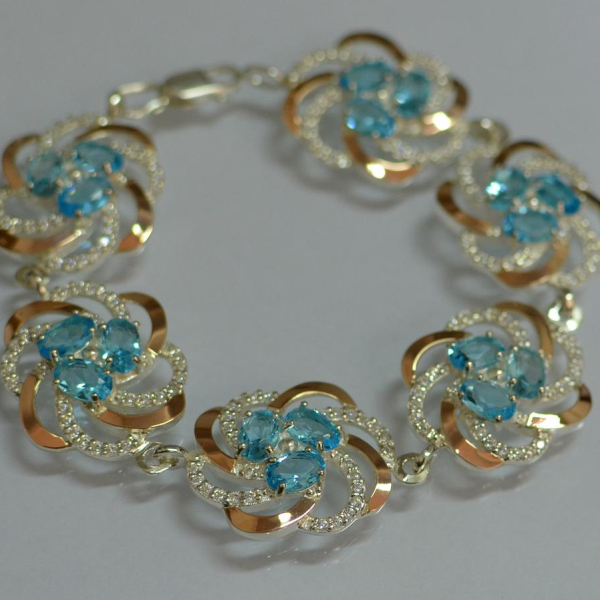 Серебряный браслет с золотыми вставками