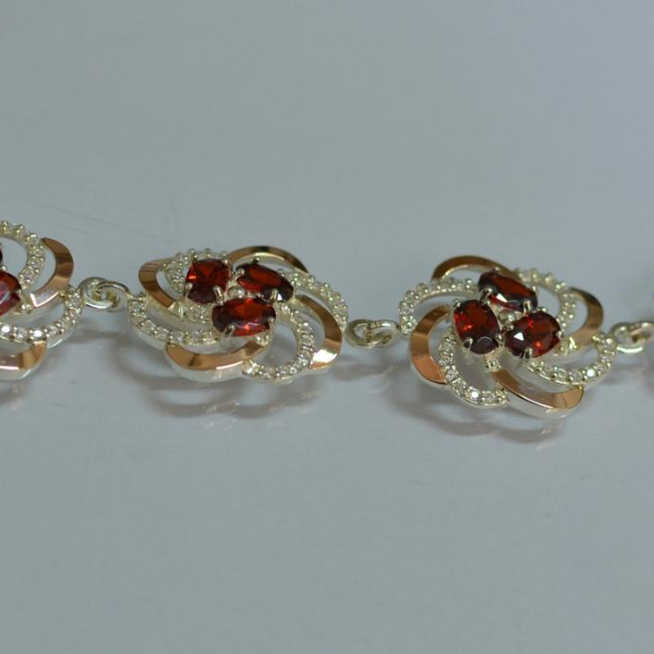 Серебряный браслет с золотыми вставками