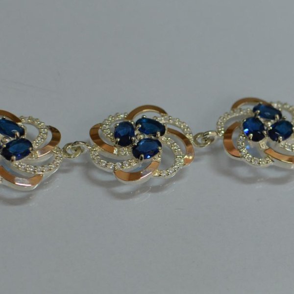 Серебряный браслет с золотыми вставками