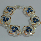 Серебряный браслет с золотыми вставками