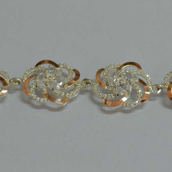 Серебряный браслет с золотыми вставками