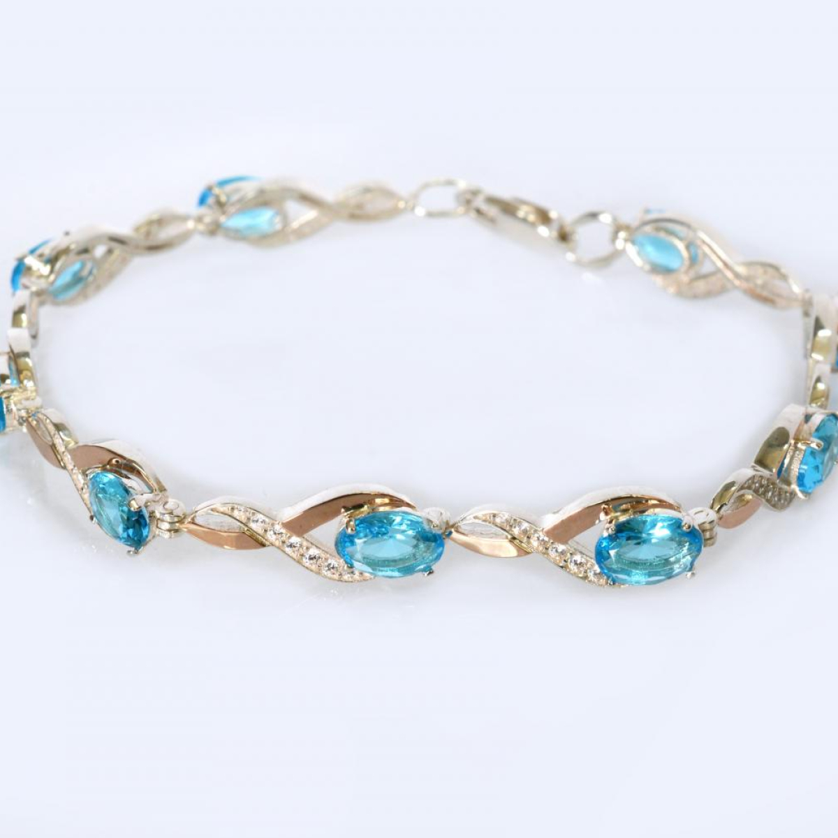 Срібний браслет з золотими пластинами та фіанітами