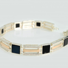 Срібний браслет з золотими пластинами та вставками з оніксу