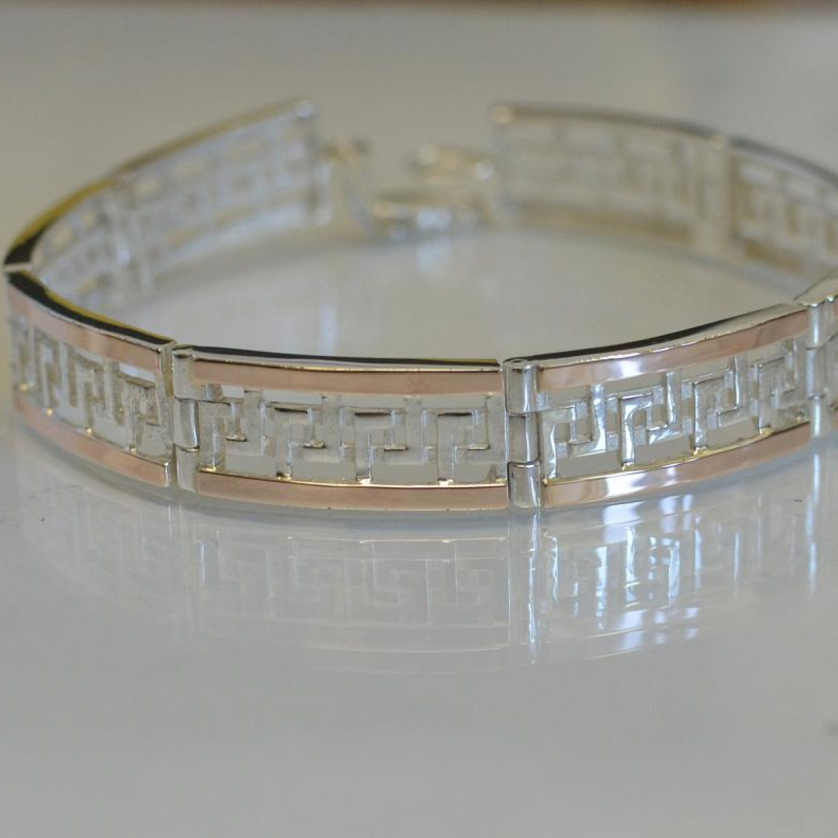 Срібний браслет з пластинами із золота