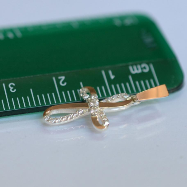 Срібний хрестик з золотими вставками