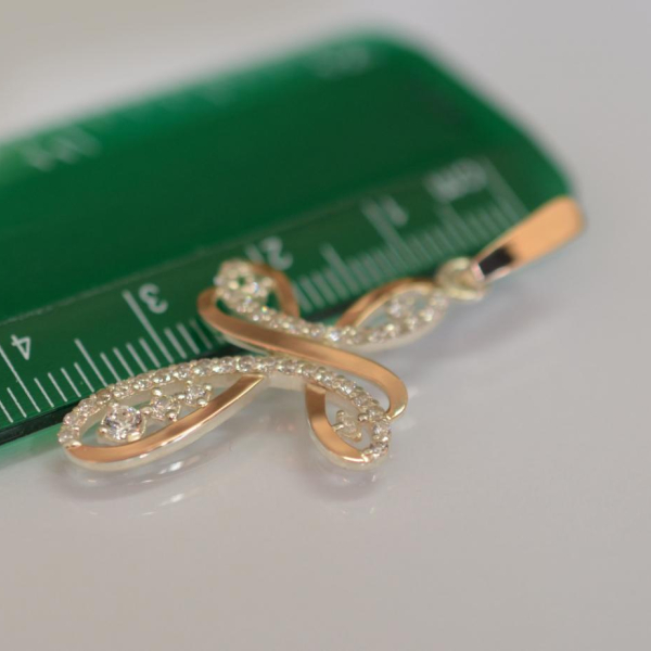 Срібний хрестик з золотими вставками