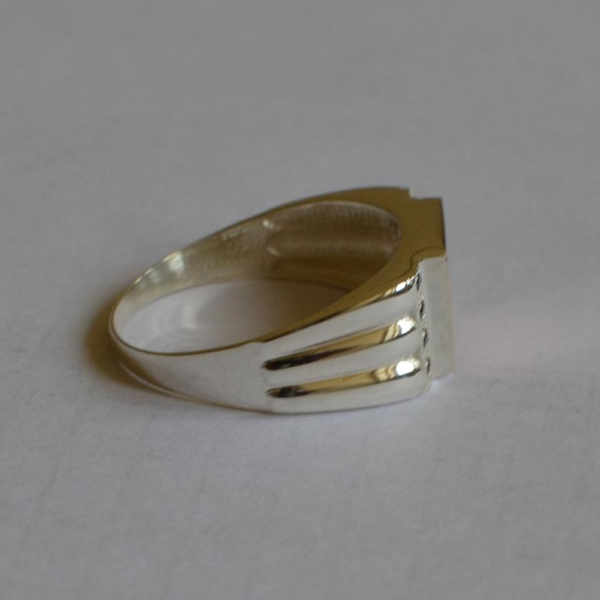 Срібний перстень з золотими пластинами