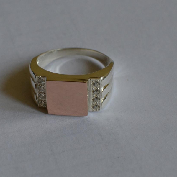 Срібний перстень з золотими пластинами