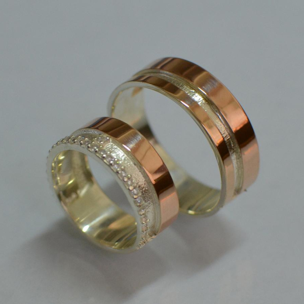 Пара срібних обручок з золотом