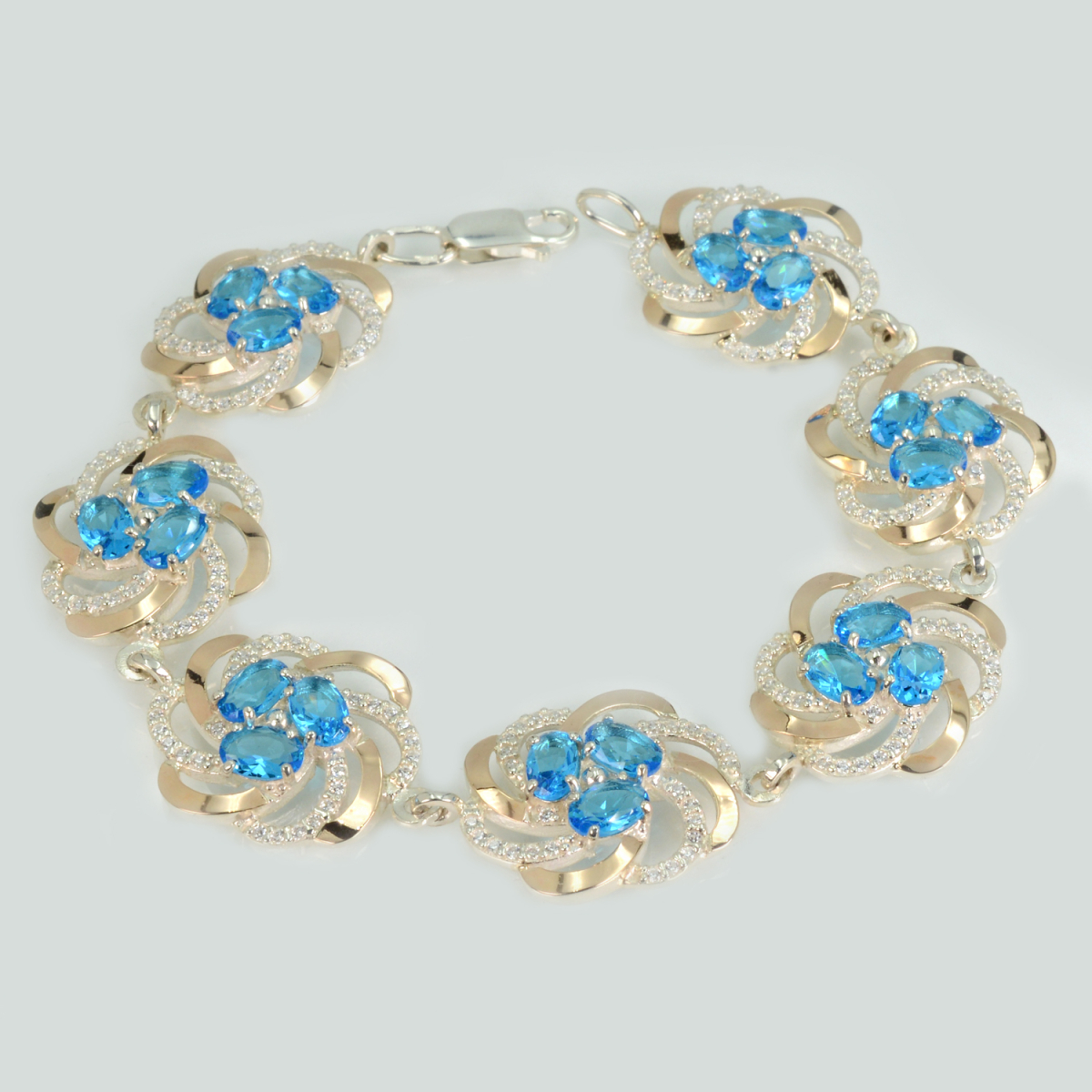 Серебряный браслет с золотыми вставками