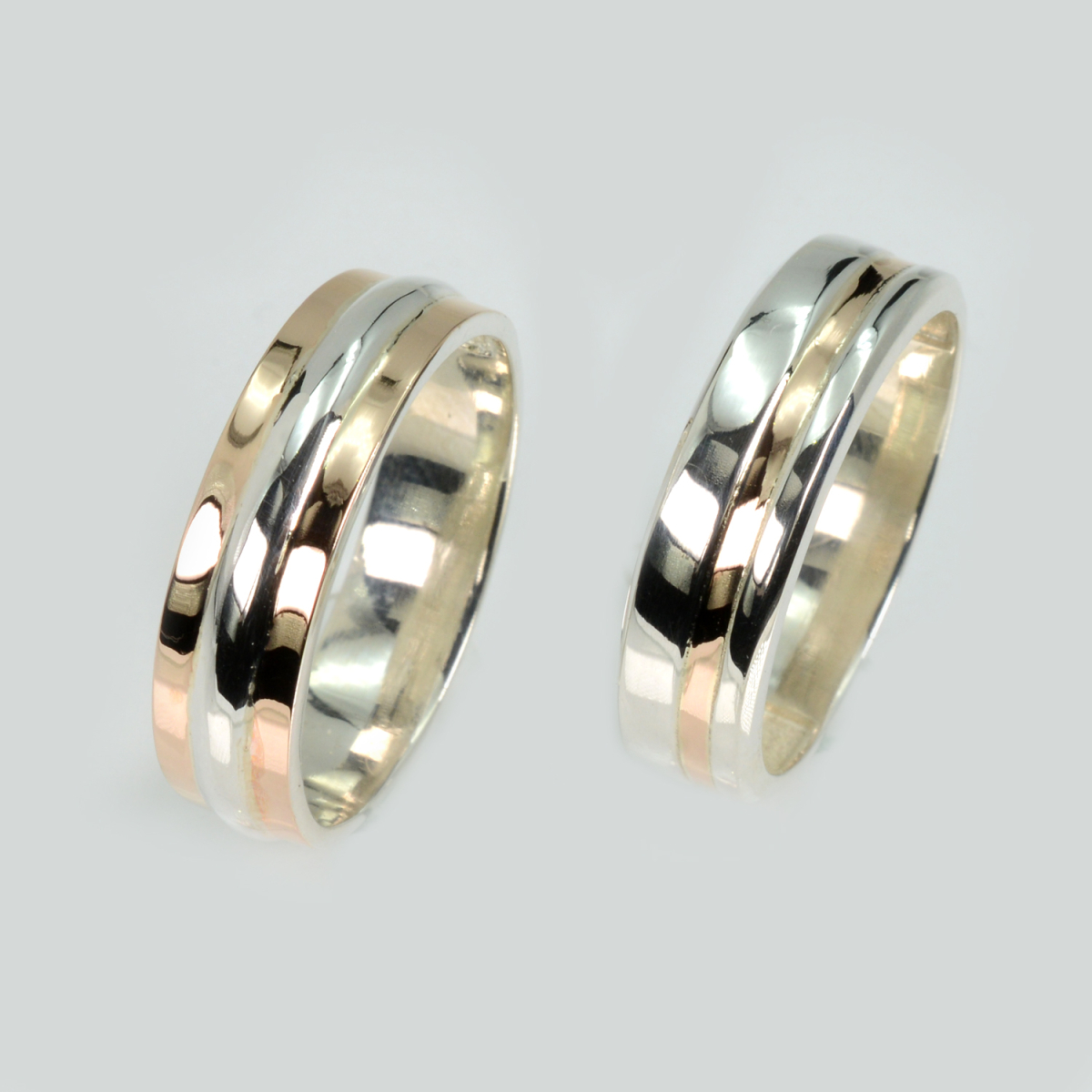 Пара срібних обручок з золотом