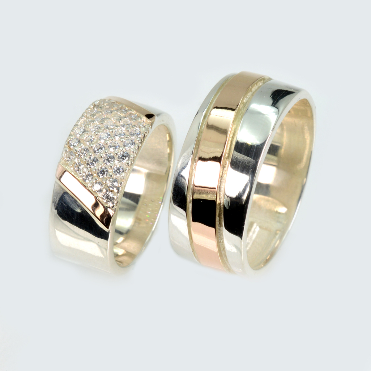 Пара срібних обручок з золотом