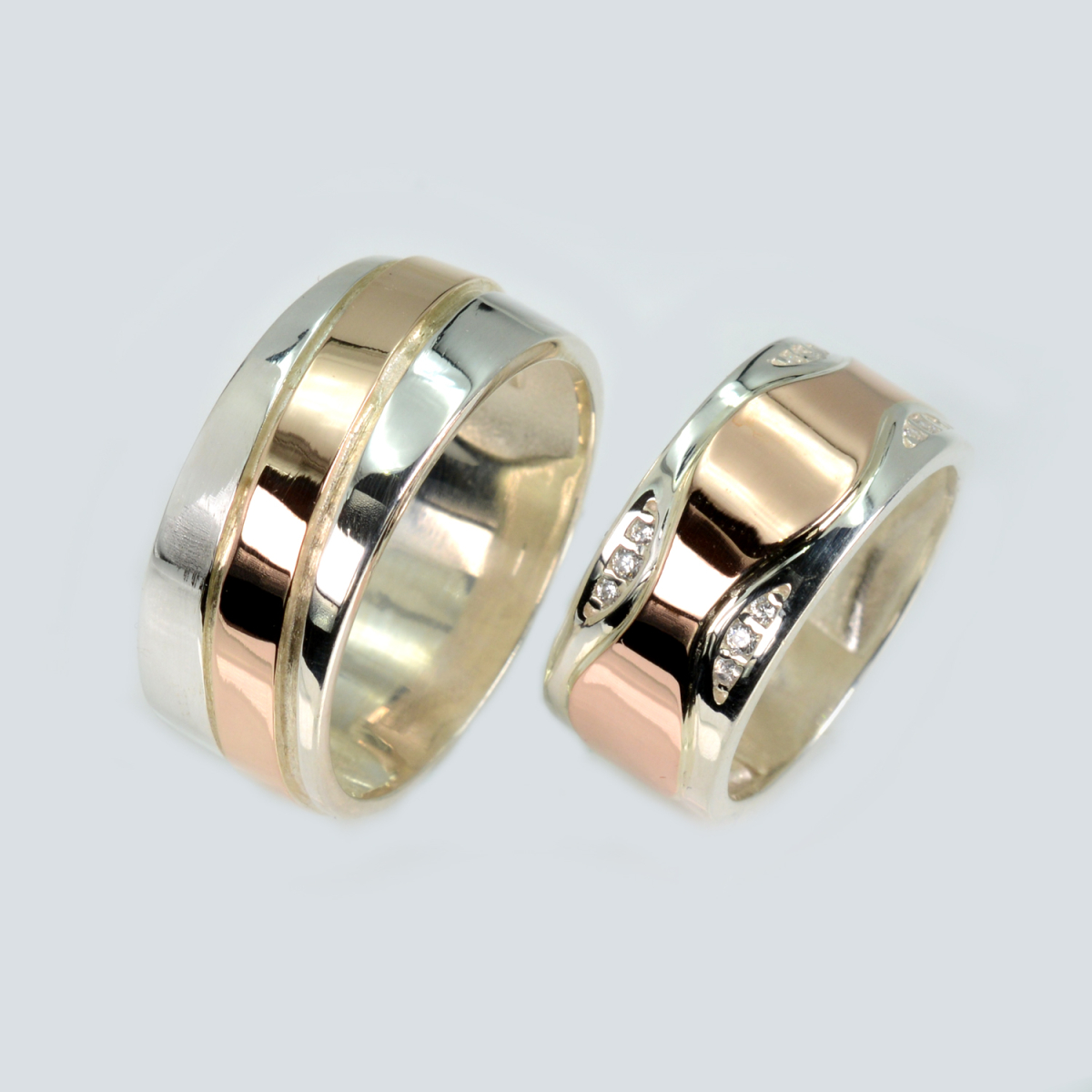 Пара срібних обручок з золотом