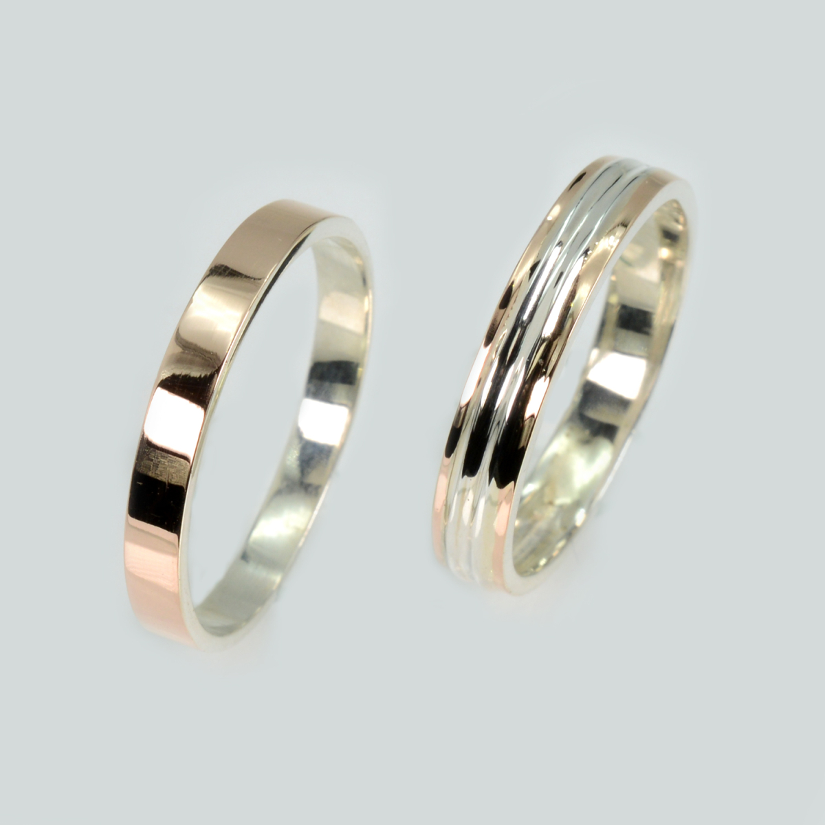 Пара срібних обручок з золотом