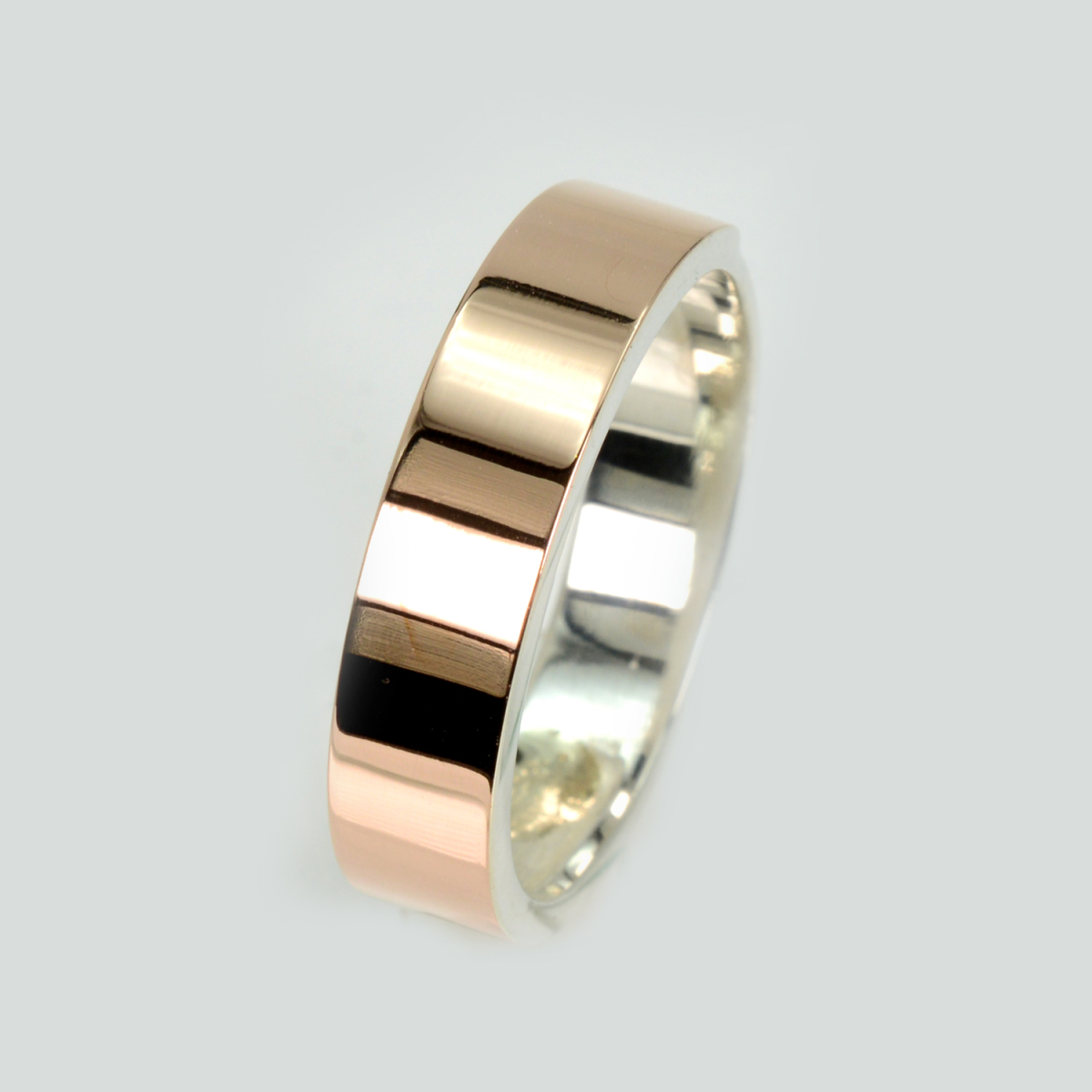 Срібна обручка з золотими напайками