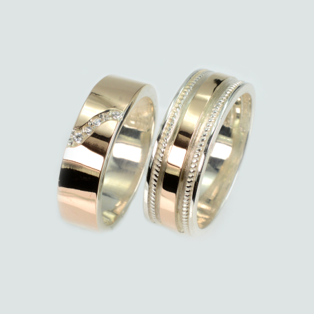 Пара обручальных колец из серебра и золота