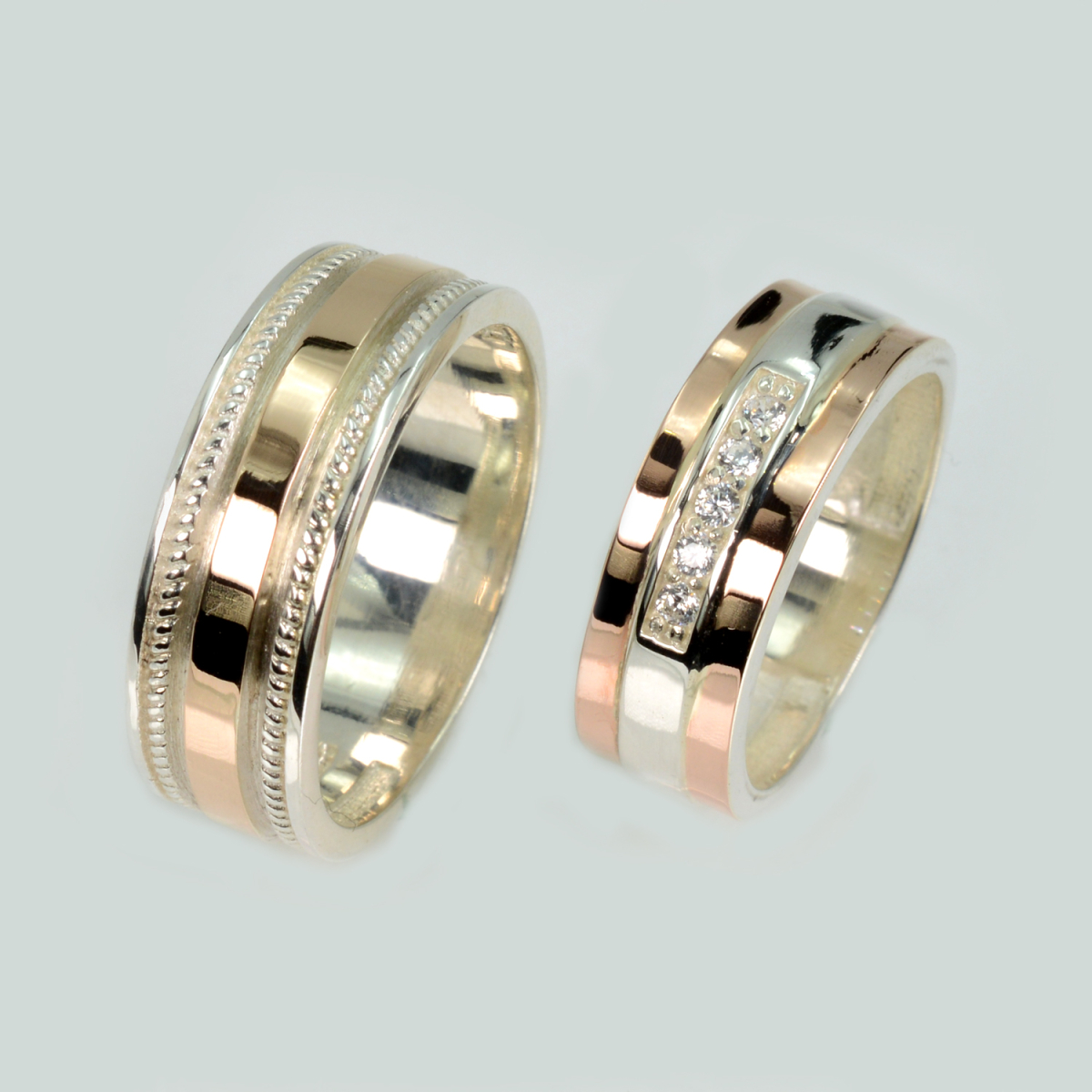 Пара срібних обручок з золотом