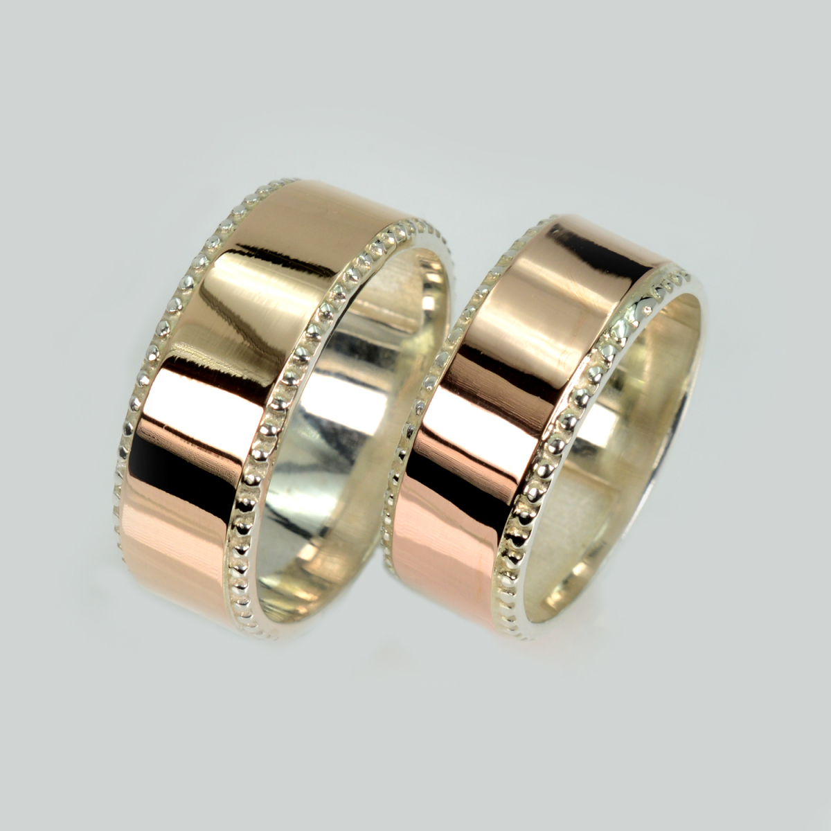 Пара срібних обручок з пластинами золота