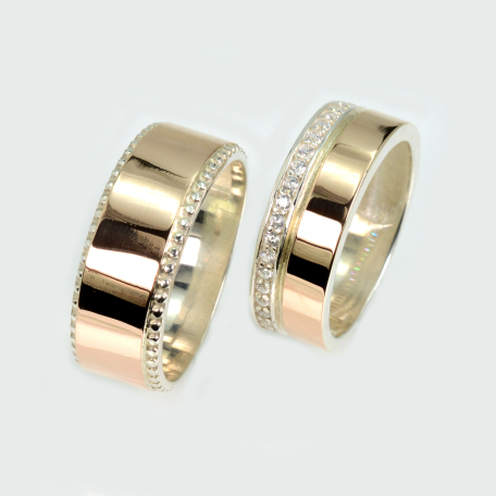 Пара обручальных колец из серебра и золота