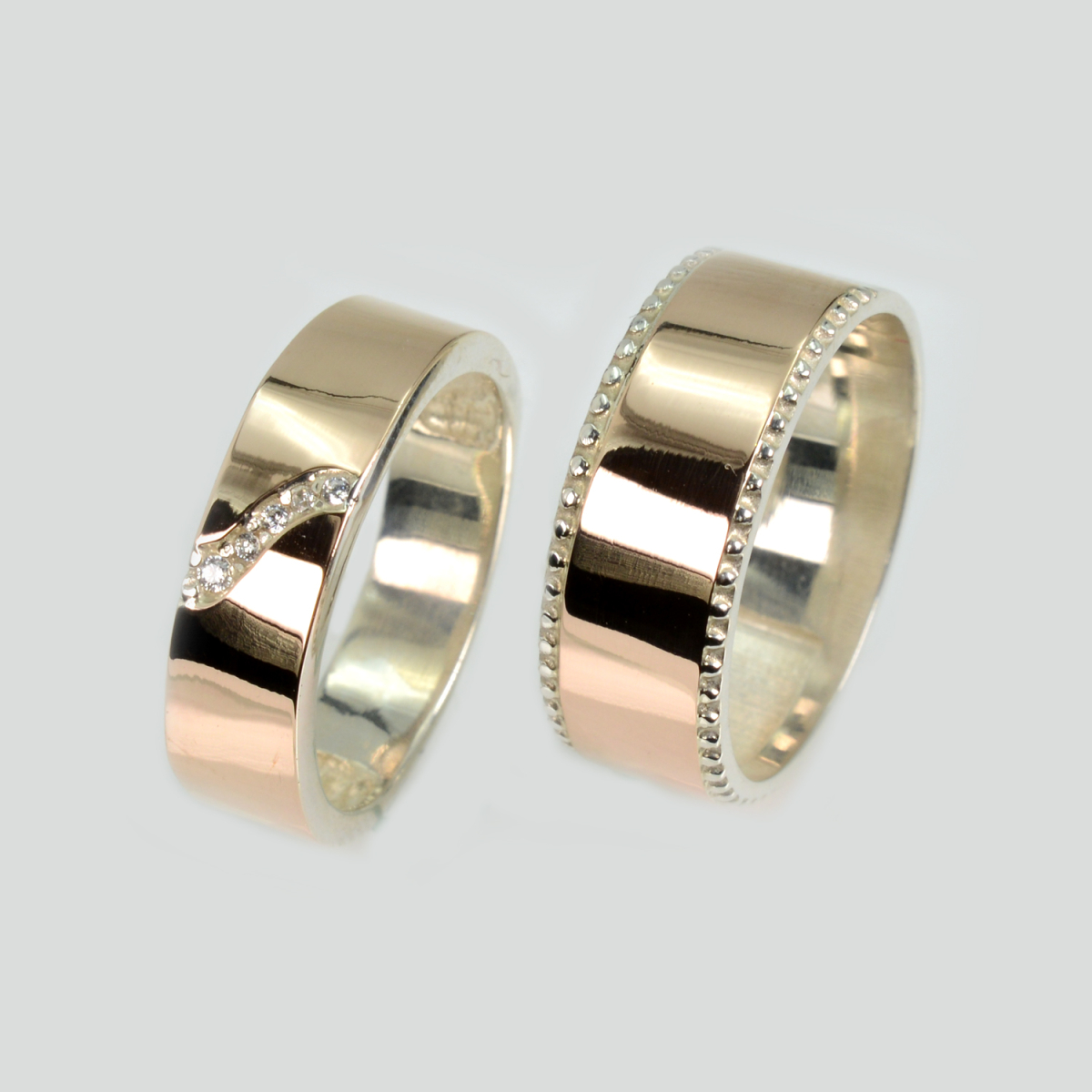 Пара срібних обручок з золотом