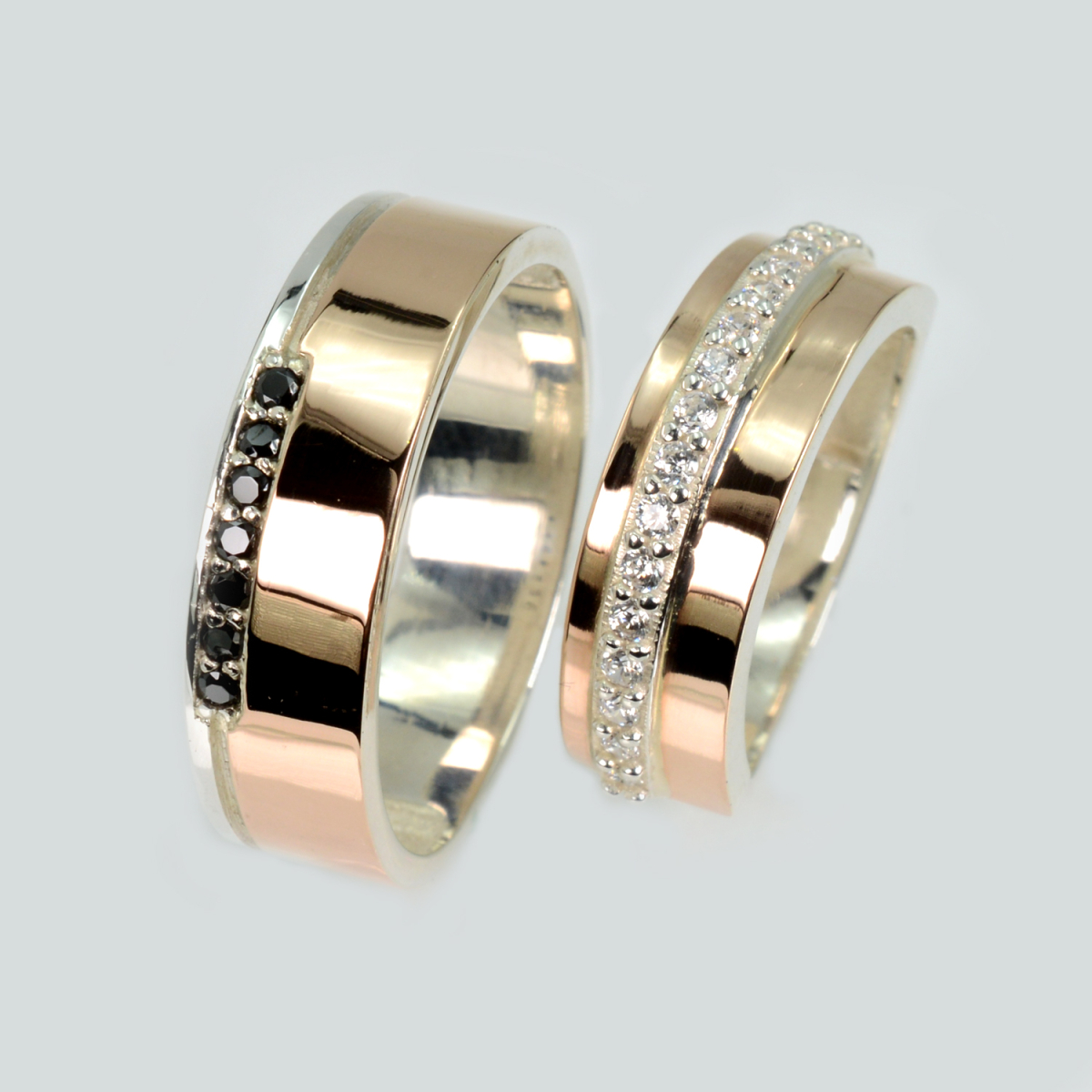 Пара срібних обручок з золотом