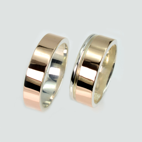 Пара срібних обручок з золотом